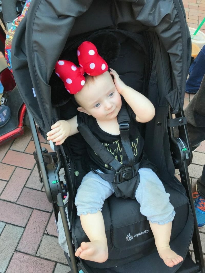 A baby reclines in an Ergobaby stroller at Disneyland