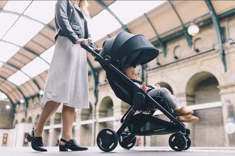 mom traveling with baby in a stroller