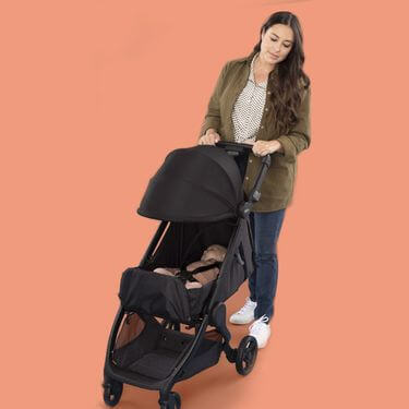 Newborn sleeping in a black metro+ stroller photo